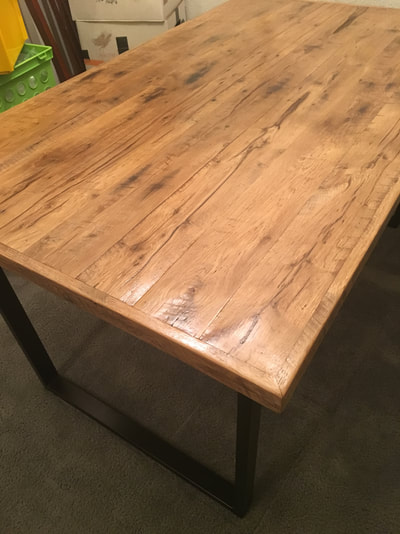 This picture shows the corner of the reclaimed white oak table.