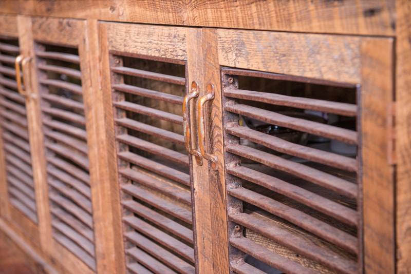Detail shot of rusty metal grate doors.