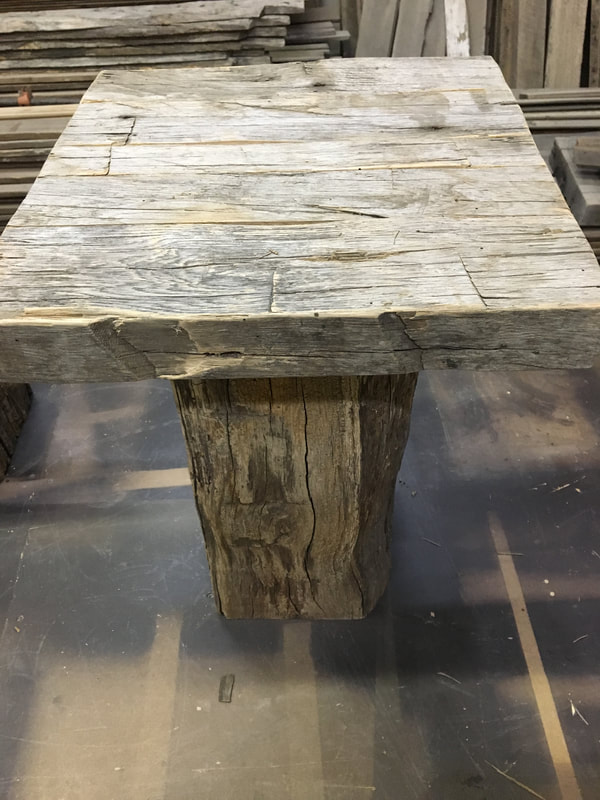 This picture shows one side  and the top to the gray hand hewn white oak side tables. 