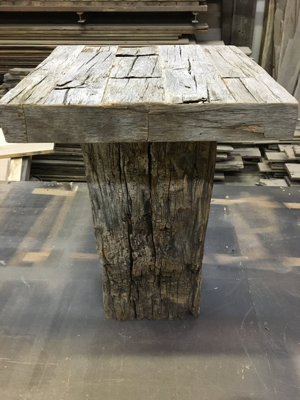This picture shows one side of the gray hand hewn white oak side tables. 