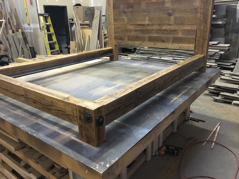 Angled view of the reclaimed wood bed frame.