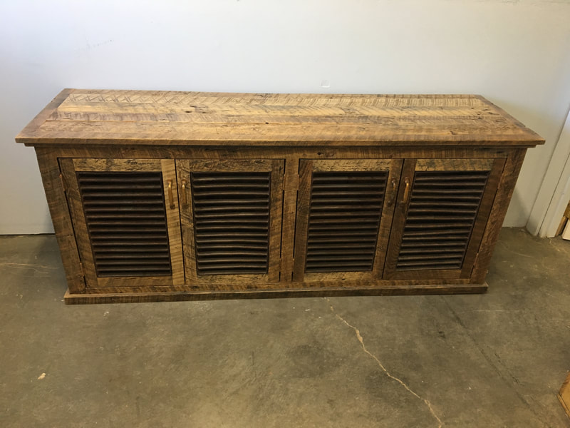 Front view of the rusty metal grates and reclaimed wood buffet