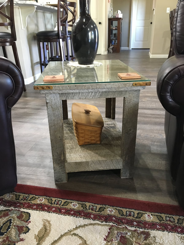 Front view to one of the gray reclaimed wood side tables