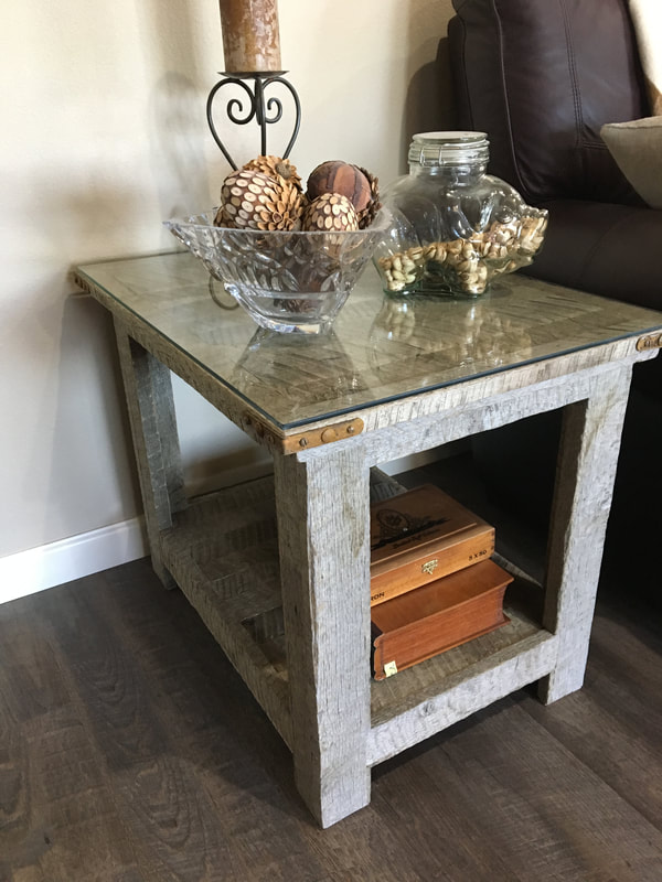 Angle view to one of the gray reclaimed wood side tables